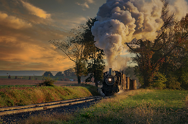 포토 JPG 해외이미지 주간 사람없음 야외 일몰 기차 시골 연기 매연 오후 증기기관차 해외포토 자연요소 육상교통 대중교통 노을 환경오염 파일형식 이미지허브